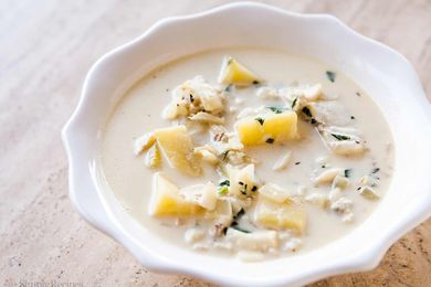 Fish chowder in a white bowl