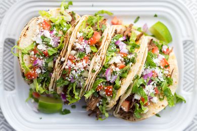 Instant Pot Pulled Pork Carnitas Tacos on a serving tray
